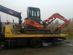 Фото перевозки спецтехники на эвакуаторе